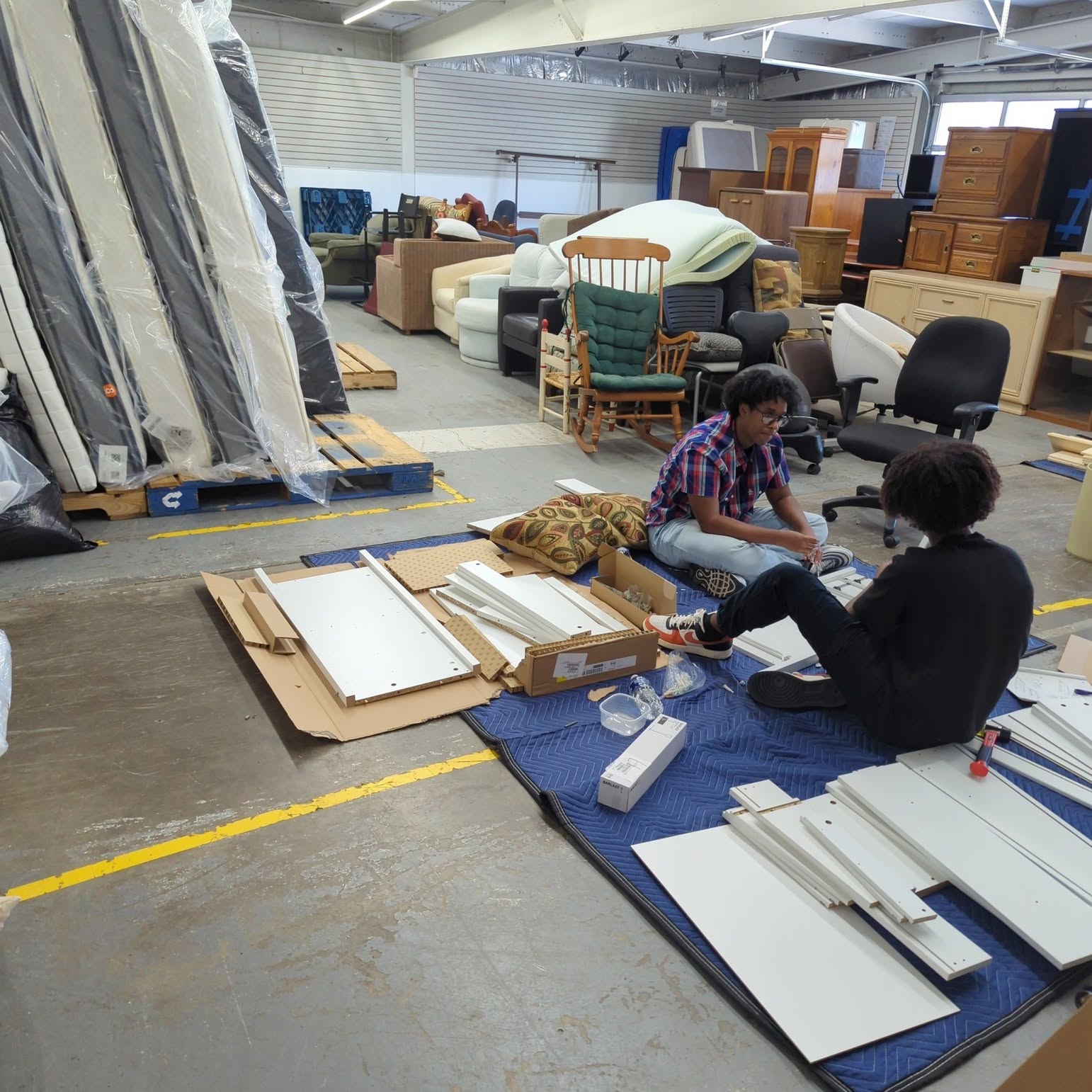 The Friends in Deed furniture warehouse stocked with donated items